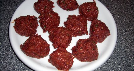 Gebackener Leberknödel mit Sauerkraut auf Pfeffersauce